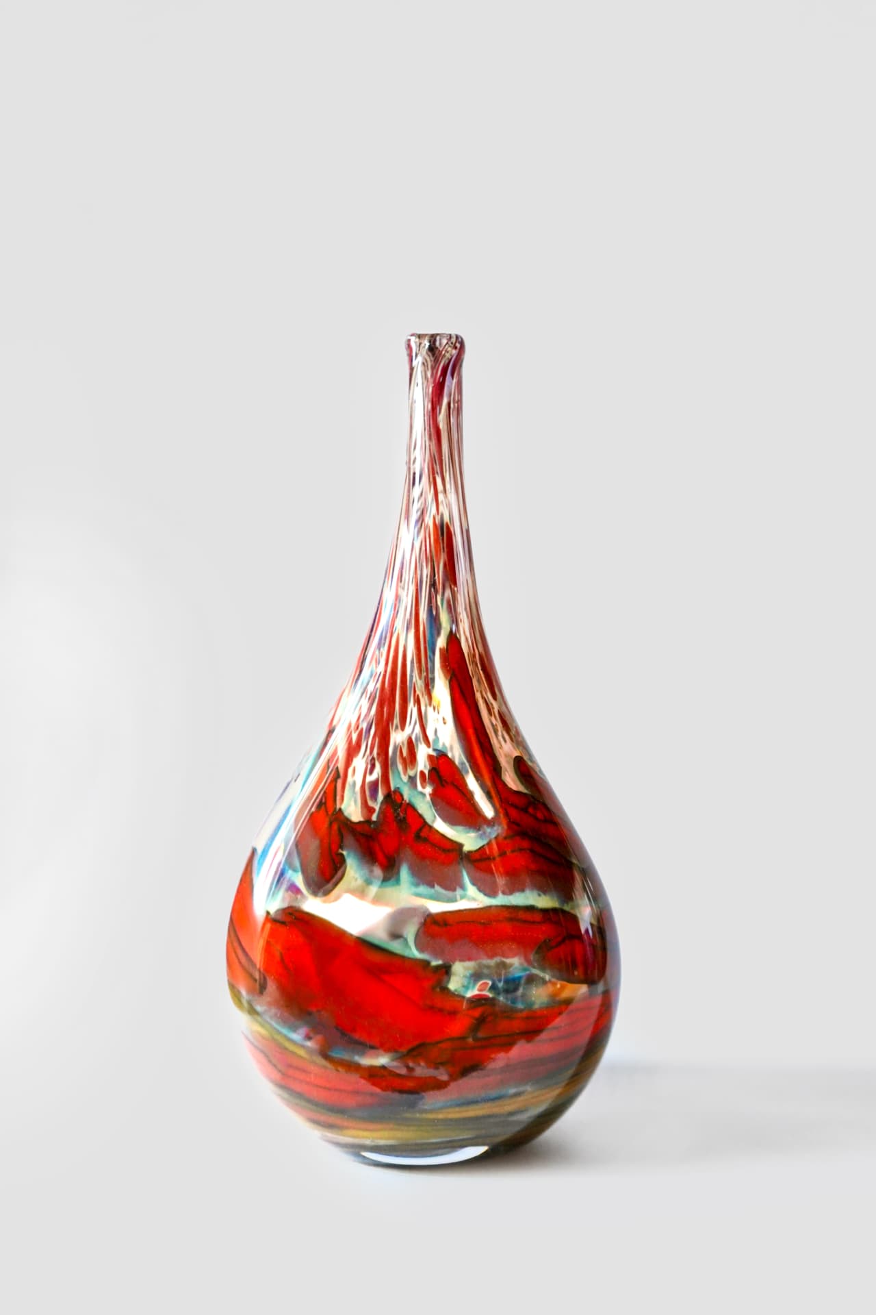 Hand-blown red glass vessel by Zach Glassman